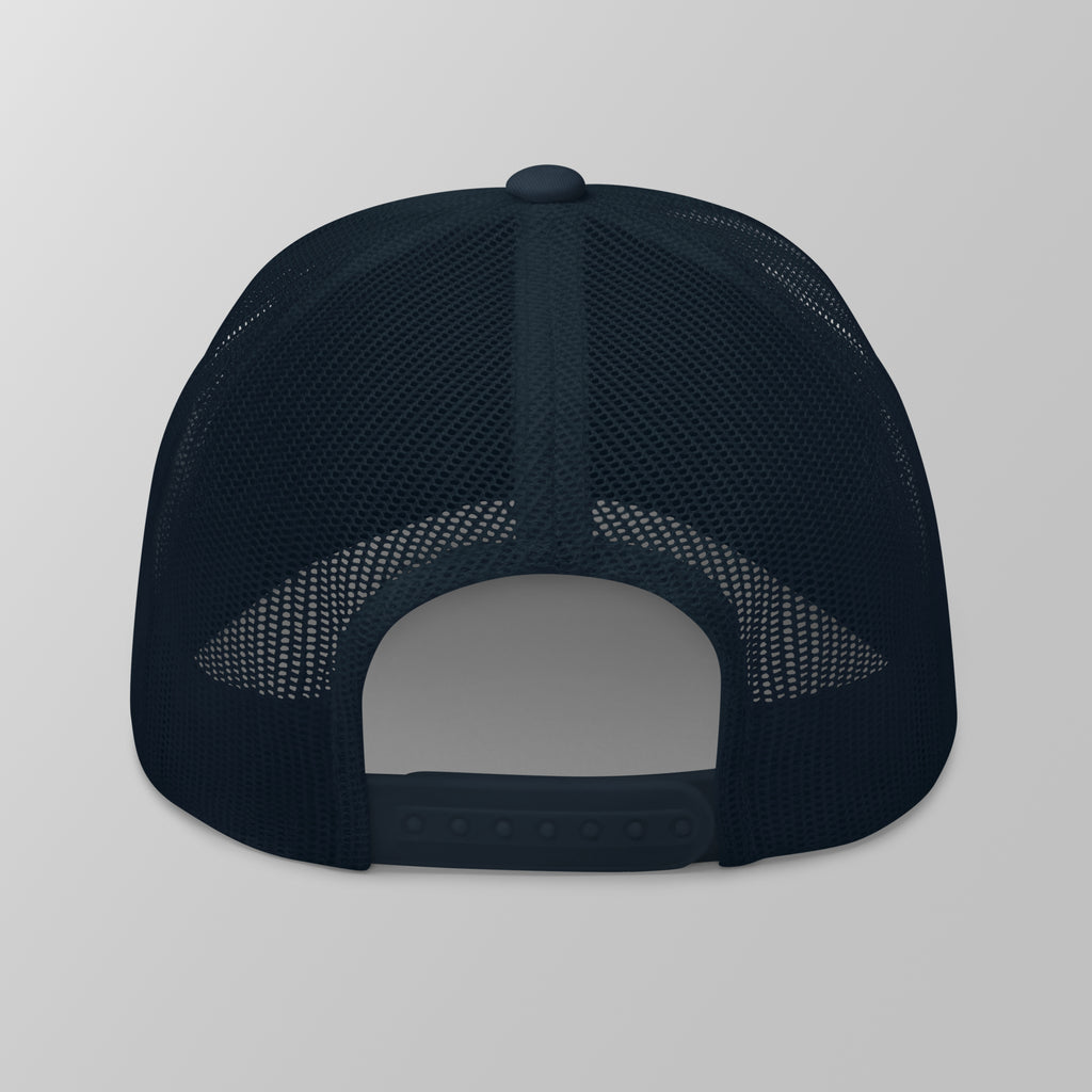 Back view of a navy blue premium padel trucker cap with a breathable mesh back and adjustable snapback strap.