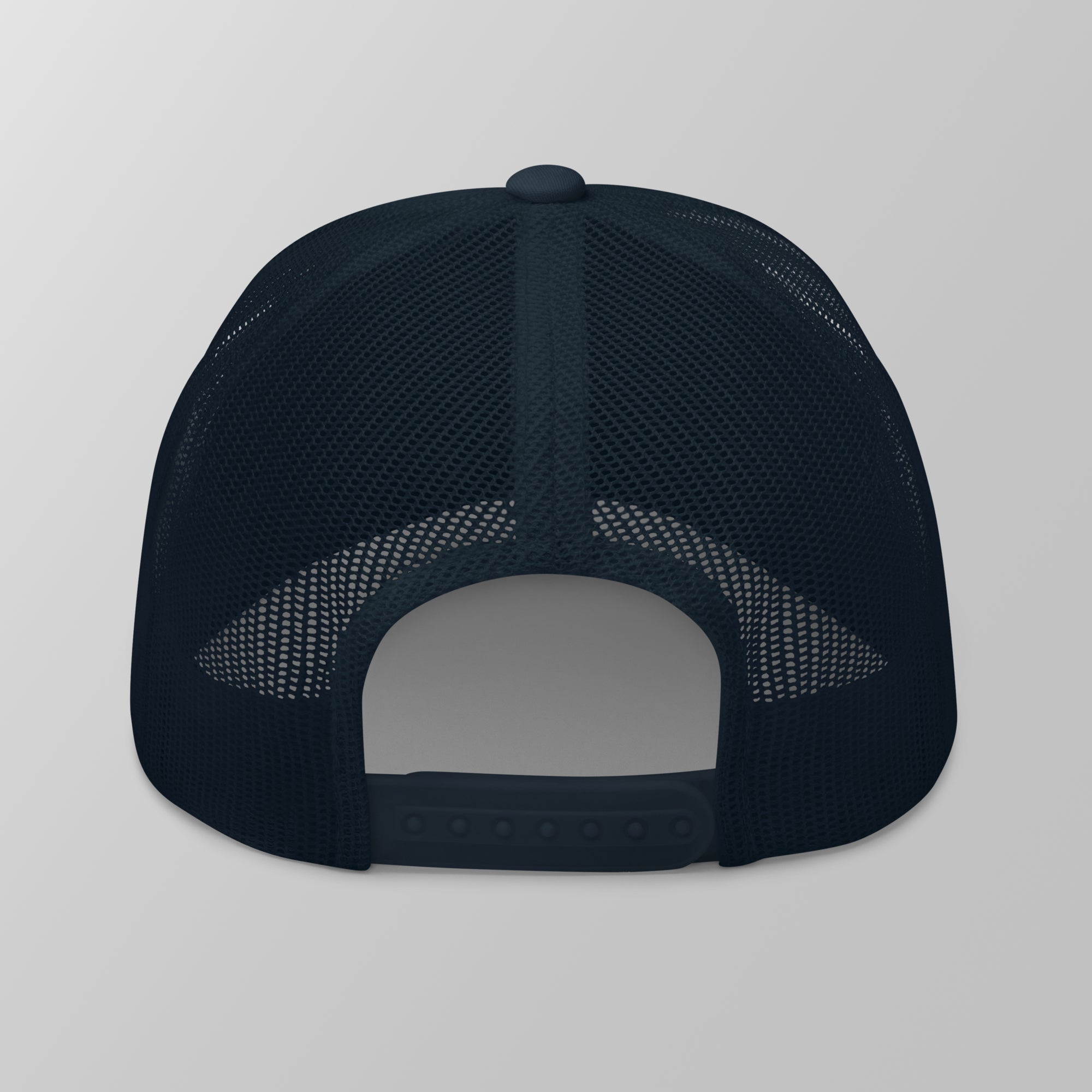 Back view of a navy blue premium padel trucker cap with a breathable mesh back and adjustable snapback strap.