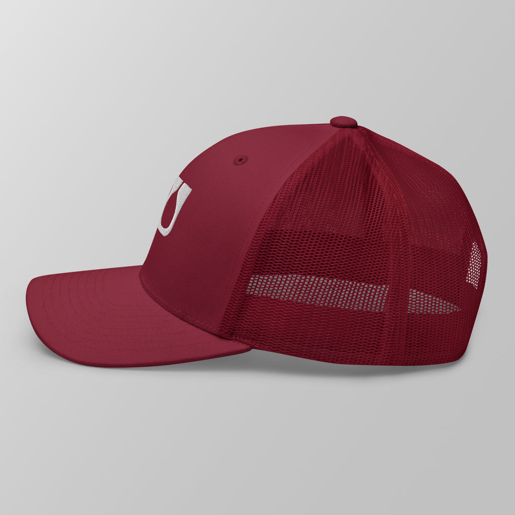 Side view of a maroon premium padel trucker cap with breathable mesh panels.
