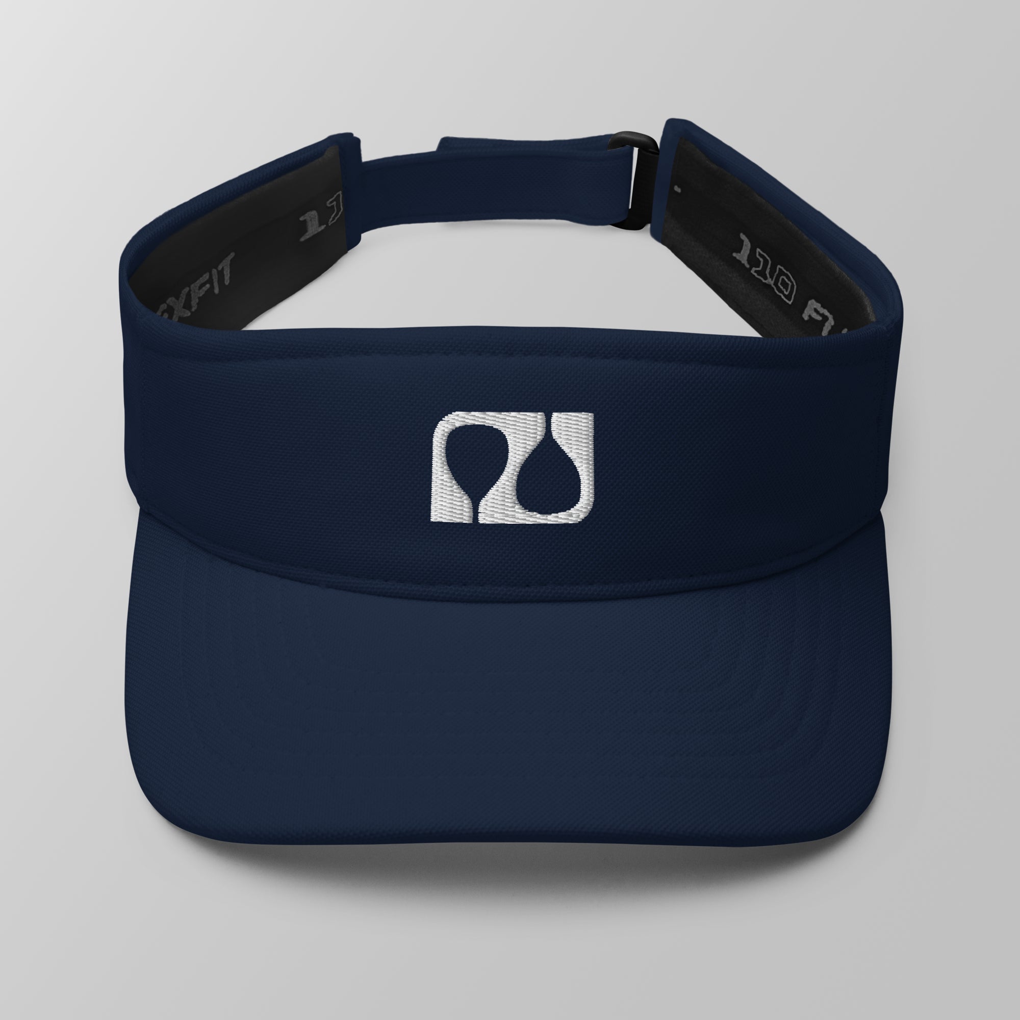Front view of a navy blue premium padel visor with a white embroidered 'Après Padel Society' logo.