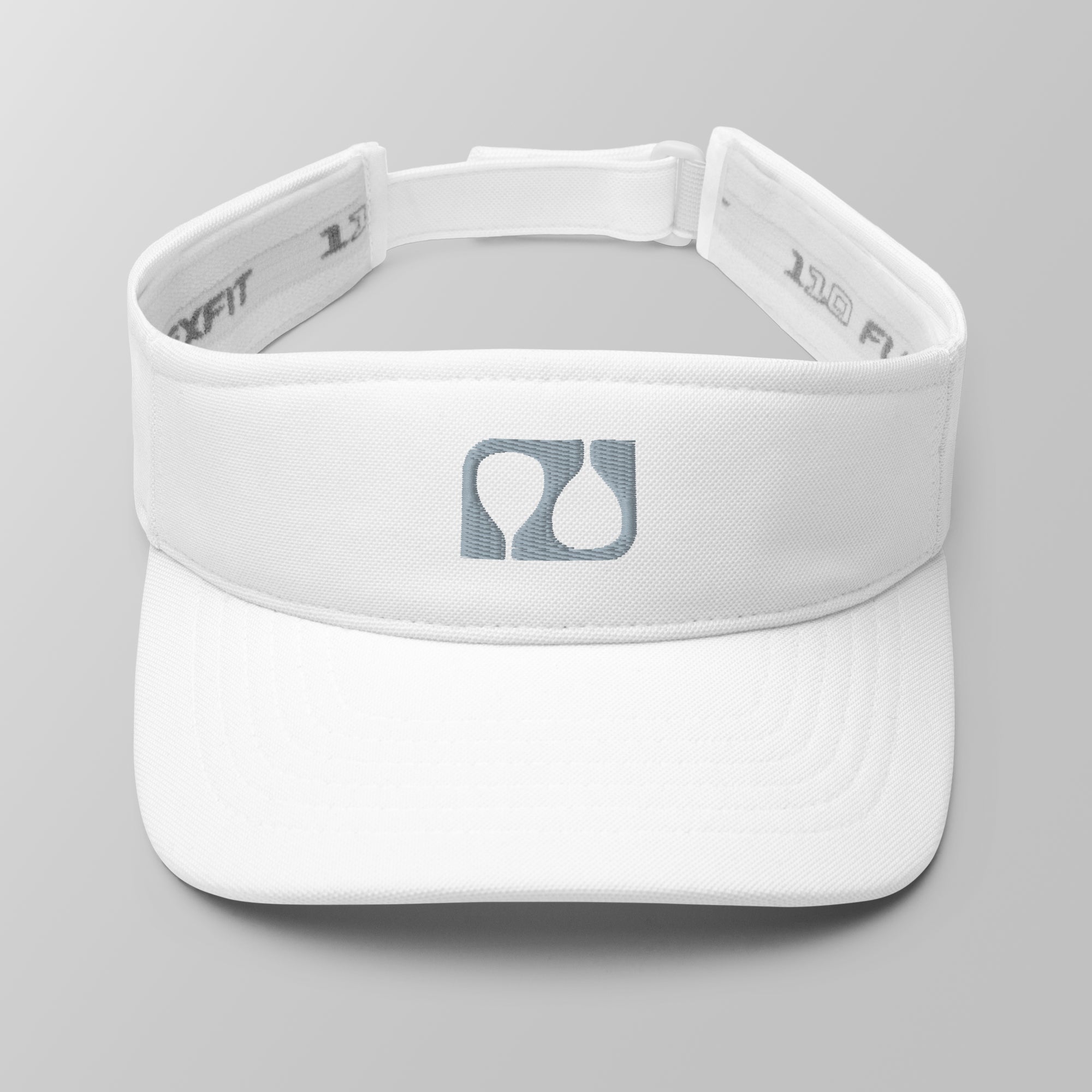 Front view of a white premium padel visor with a grey embroidered 'Après Padel Society' logo.