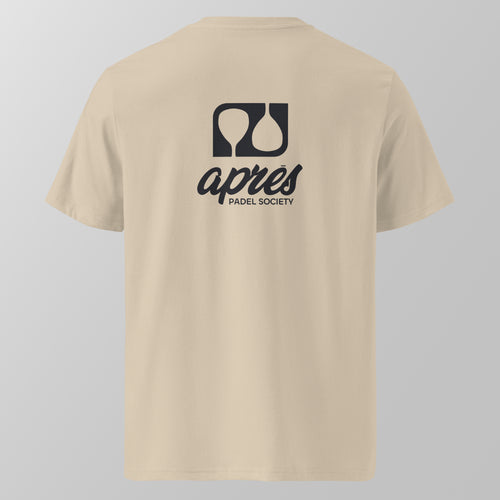 Back view of an ecru relaxed fit oversized unisex padel t-shirt with the large black 'Après Padel Society' logo. 