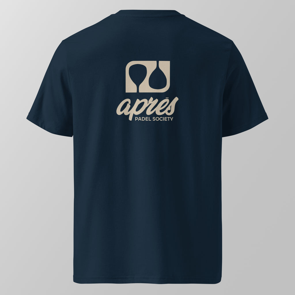 Back view of a navy blue relaxed fit oversized unisex padel t-shirt with the large tan 'Après Padel Society' logo. 