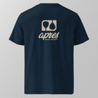 Back view of a navy blue relaxed fit oversized unisex padel t-shirt with the large tan 'Après Padel Society' logo. 
