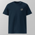 Front view of a navy blue relaxed fit oversized unisex padel t-shirt with a small tan logo on the left chest.