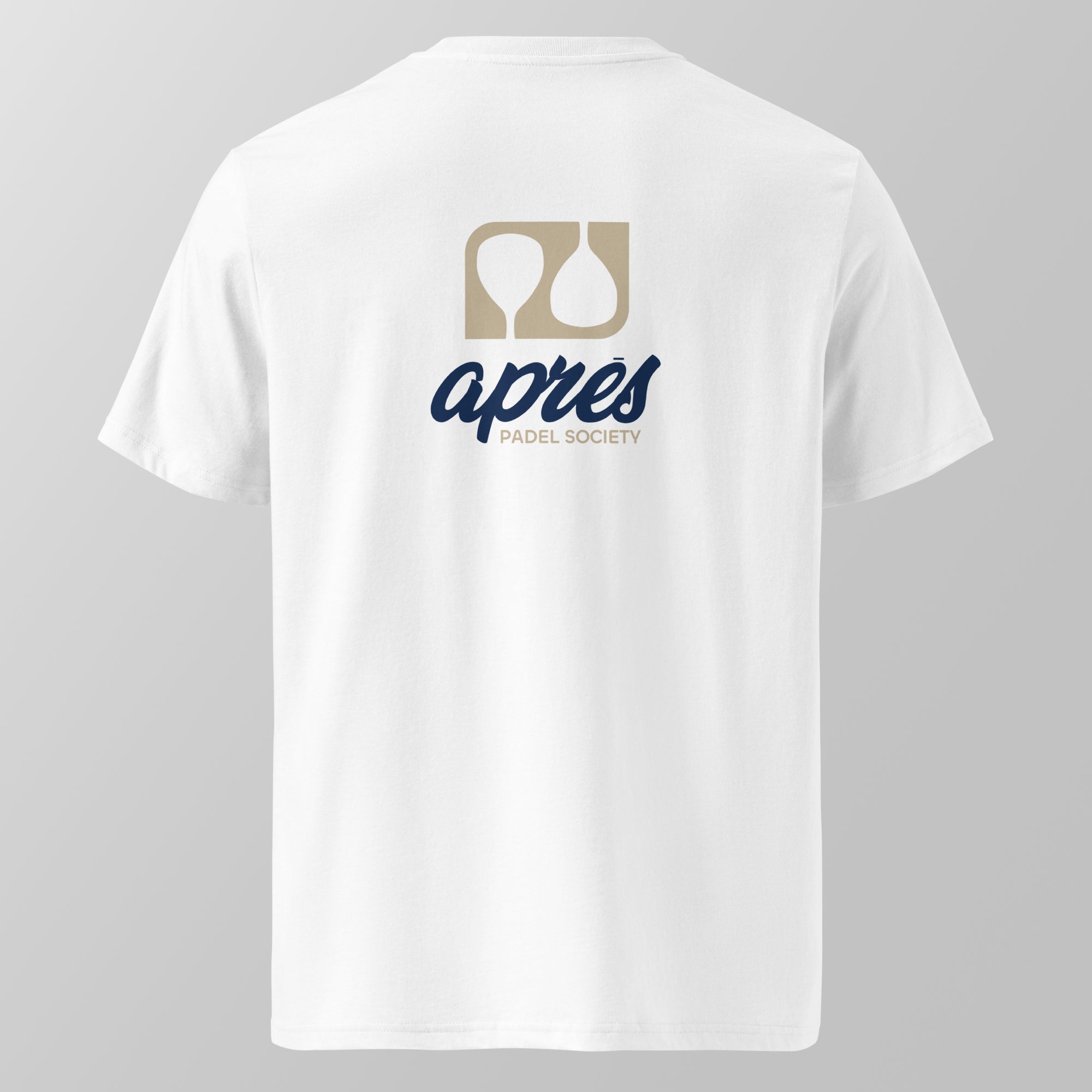 Back view of a white relaxed fit oversized unisex padel t-shirt with the large tan and navy 'Après Padel Society' logo. 