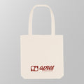 Front view of a premium cream padel tote bag with the red 'Après Padel Society' logo. 