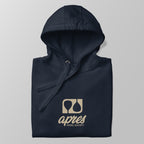 Close-up of a folded navy blue premium padel hoodie with the tan 'Après Padel Society' logo centred.
