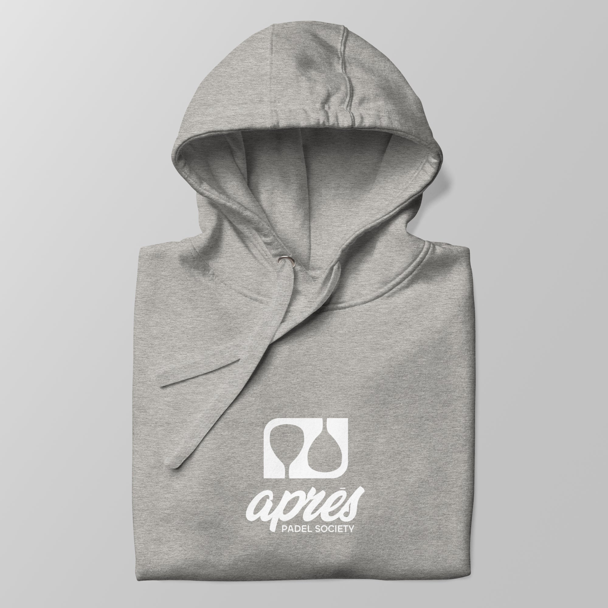 Close-up of a folded heather grey premium padel hoodie with the white 'Après Padel Society' logo centred.